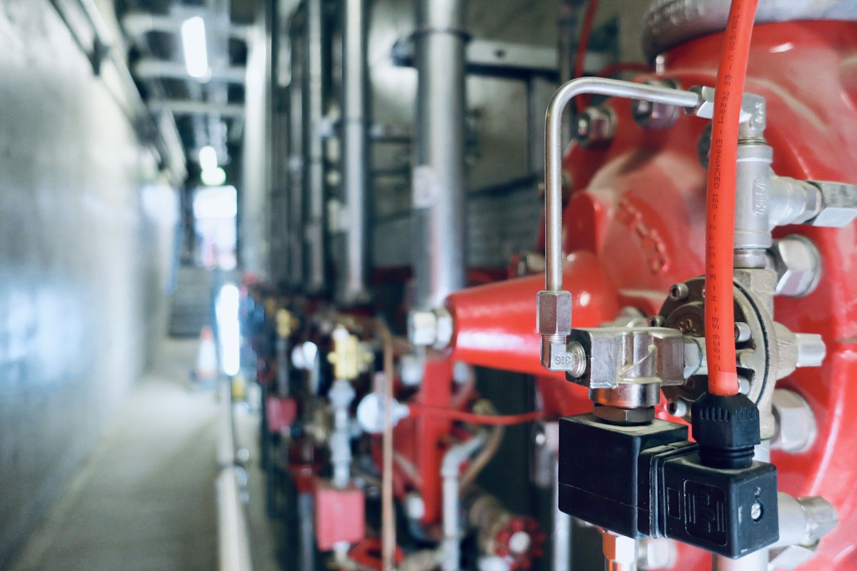 Valves and gauges on a building fire-suppression pump set.